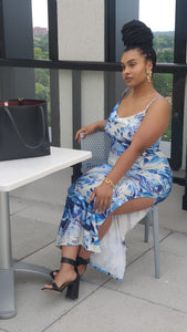 Lady wearing Blue Floral dress sitting